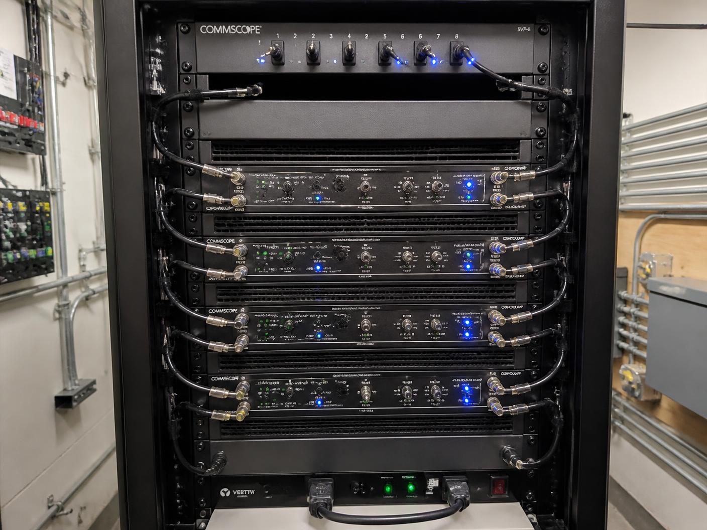 Bi-directional amplifier head-end rack in an equipment room